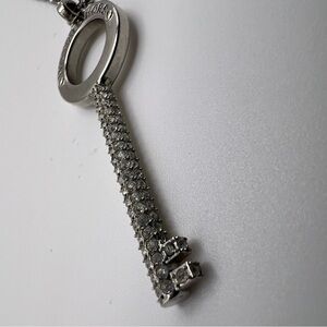 Authentic Michael Kors silver-tone pave key pendant